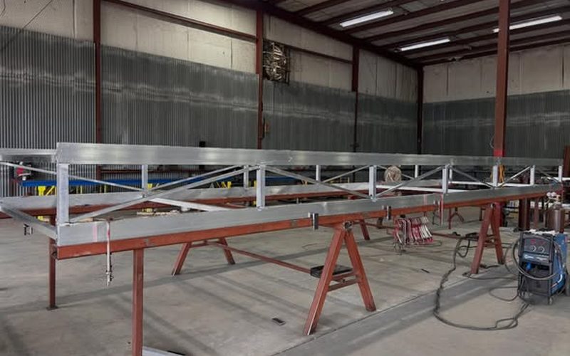 Structural steel truss platform fabrication in the Trait shop