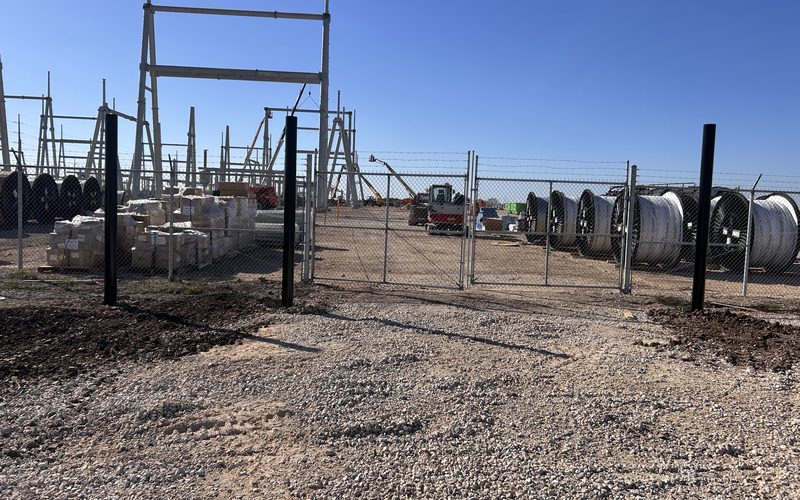 Steel security posts and perimeter fencing at a substation